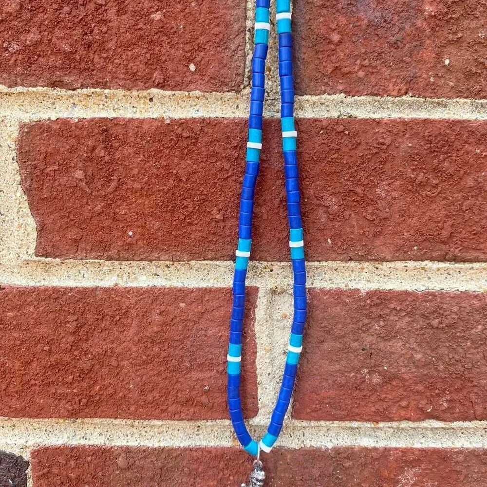 y2k Pukka shell inspired dinosaur necklace